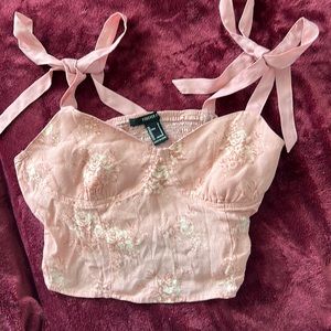 Size-Small. Color-Light pink. Very cute floral design perfect fit for the summer